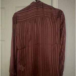 Small button up blouse. Never worn